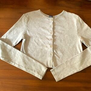 Cropped grey button down long-sleeved tshirt from Brandi Melville